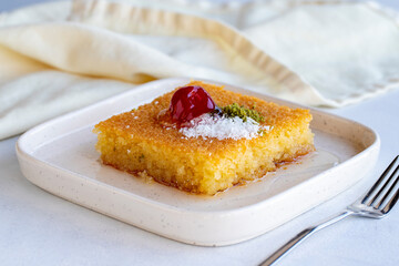 Kadayif dessert with pistachio on a white background. Traditional Turkish cuisine delicacies. close up
