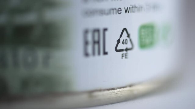 4k Closeup view of 40 Fe recycling sign or label and others on white packaging spbd. 40 FE is steel (tin). The following are accepted for processing: cans, lids from glass jars and other all-metal