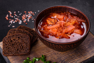 Traditional Ukrainian borsch. Bowl of red beet root soup borsch with green onion