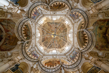 Church chandelier under main dome of Saint Nicholas church in Prague