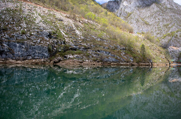 A series of cruises on the Drina River. The mirror of the emerald waters. Symmetry in the close-up.