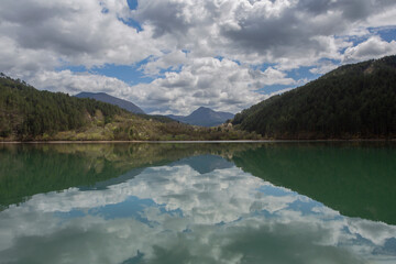 A series of reflections on the Drina River with reflection. Symmetry and harmony.