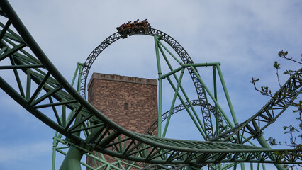 Sierksdorf, Germany - April.30.2022: Sierksdorf, Germany - April.30.2022: People have fun on the extreme steel rollercoaster "Der Schwur des Kärnan" in the theme park "Hansa-Park"  © D. Pfleiderer