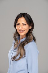 Obraz premium Studio headshot of beautiful Asian Indian woman in blue blouse.