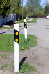 poles to stand on the road