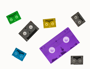 multi coloured retro plastic cassette tapes on white background