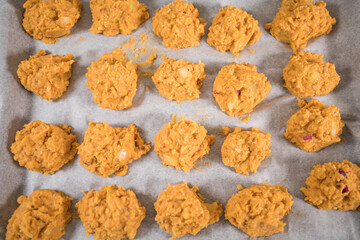 Homemade vegetarian potato and lentil meatballs on an oven tray.