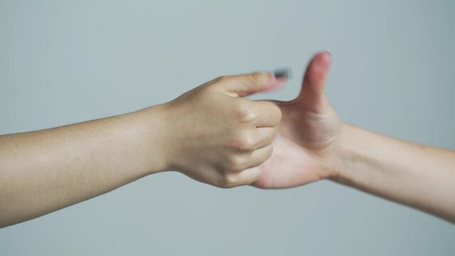 Thumb wrestle between two people. Human arm and thumb wrestling. Woman and man hands playing thumb wars closeup, arm gestures concept. Two hands show gestures, fight with fingers, move. Close up