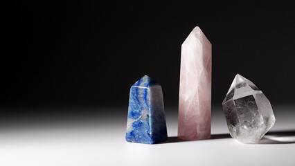 Set crystal gemstones for meditation and chakra healing on gray background with copy space. Concept of relaxing practice