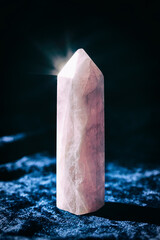 Healing Chakra rose quartz crystal on velvet textile background close-up. Meditation, Reiki or spiritual healing practice