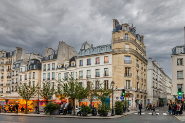 Saint-Antoine street and its residential buildings, at sunset, in autumn, in Paris, France