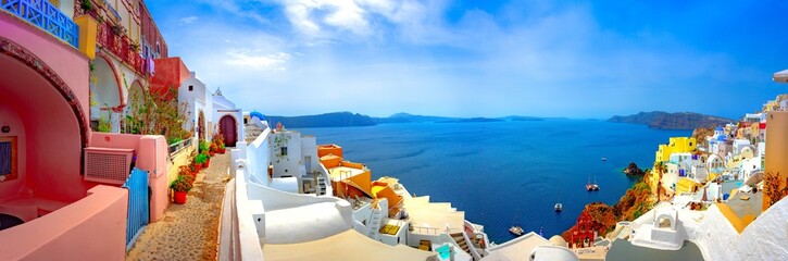Oia town on Santorini island, Greece. Traditional and famous houses and churches with blue domes...