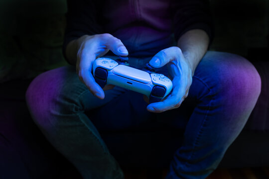Man holding Playstation 5 controller, 17 May, 2022, Sao Paulo, Brazil.