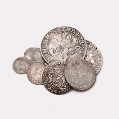 Old coins isolated on white background. Selective focus.