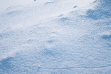 Soft fluffy snow covered floor on hill in winter