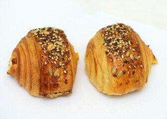Fresh croissant on a white background, perfect for breakfast.