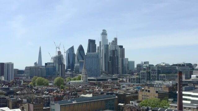 Rising aerial shot of City of London skyscrapers from the east