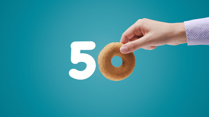 Number 50 written with donut shaped cookie