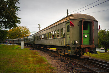Fototapeta na wymiar Retro-style historical steam train in motion on the train track in Essex, Connecticut