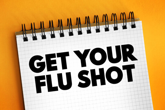 Get Your Flu Shot text on notepad, medical concept background