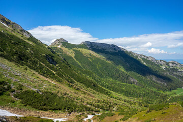Fototapeta na wymiar Giewont peak silhouette against the clouds background. Western Tatra Mountains.