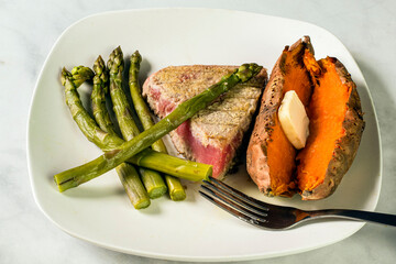 season tuna steak with sweet potato and asparagus,