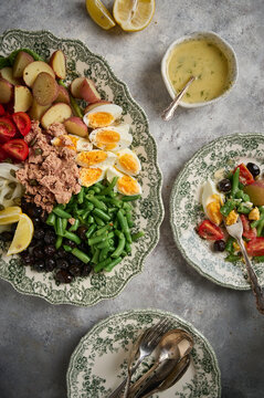 Salad with tuna, tomatoes, eggs and onion. Classic Nice aka Nicoise salad.