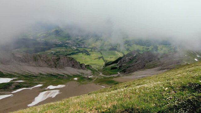 Fog and clouds comming in on the Brienzer Rothorn looking in to the valley in the swiss alps