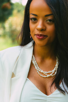 Potrait Of A Black Woman With White Blazer In Nature