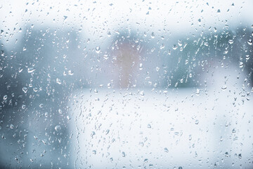 Rain water drops on window glass. Raindrop on the glass. Abstract raindrop background. Water drops close up view.