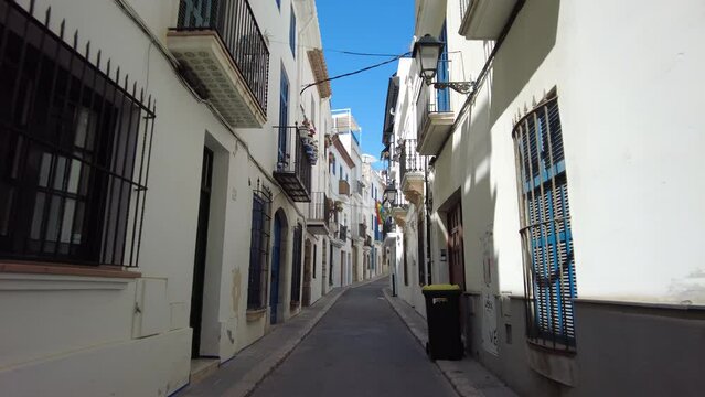 Walking on a narrow street in Sitges, Costa Dorada in Catalonia, spain