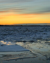 Spring ice drift on the river at sunset. Northern Dvina, Arkhangelsk.