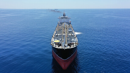 Aerial drone photo of crude oil tanker carrier anchored in deep blue open ocean sea