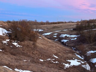 Creek in a ravine with the remains of melting snow. spring landscape