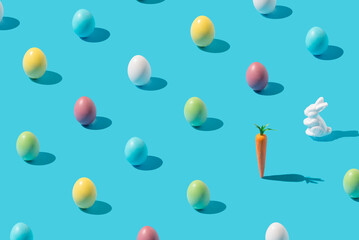 Fototapeta na wymiar Creativ pattern made of colourful Easter eggs on blue background