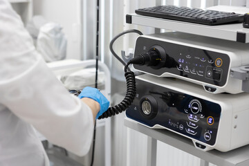 Endoscopy in the hospital. The doctor connects the endoscope before gastroscopy. Medical examination