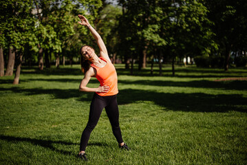 Sports woman doing exercise in the morning at dawn.