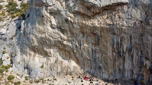 Aerial footage of climbers on the rocks on sunny day. Kalymnos, Greece.