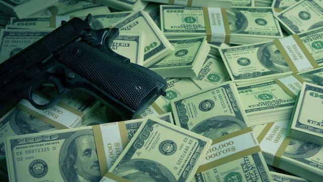 Gun On Pile Of Money Moving Shot