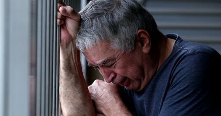 Person suffering from mental illness crying in despair