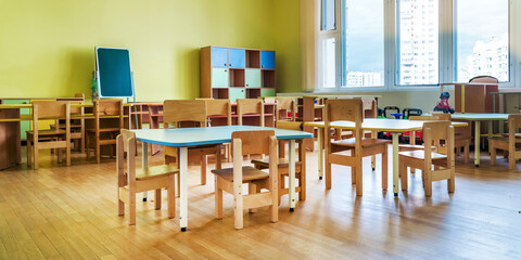 Empty classroom of daycare center without children and teacher. Education concept. - obrazy, fototapety, plakaty