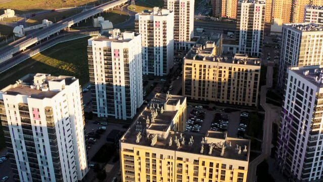 Top view of city with residential areas. Stock footage. Modern residential areas with landscaping. Lot of residential buildings in modern city in summer