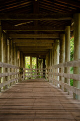 Fototapeta premium Wooden structure, with bridge, that passes over a lake. 
