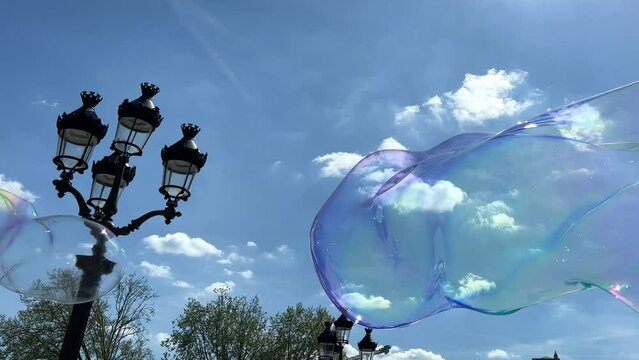Soap bubbles on blue sky. High quality 4k footage