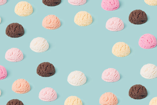 Ice cream scoops pattern with copy space on a pastel blue background. Summertime, dessert minimal concept.