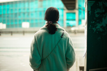 Woman is waiting for transport.