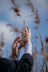 hand and grass