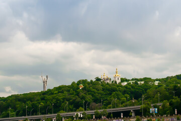 Obraz premium Travel cityscape river Dnipro,Motherland monument,statue,Lavra church temple,monastery.Historical ancient national heritage sights.Peace,freedom,patriotism memorial symbol-Ukraine Kiev,25 June 2019
