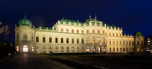 Illuminated Upper Palace in historical complex Belvedere at night, Vienna, Austria