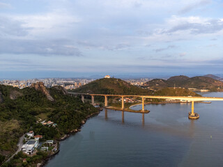Fototapeta na wymiar Amazing coastal city one of the capitals of Brazil Vitoria with long bridge over the canal - aerial drone view